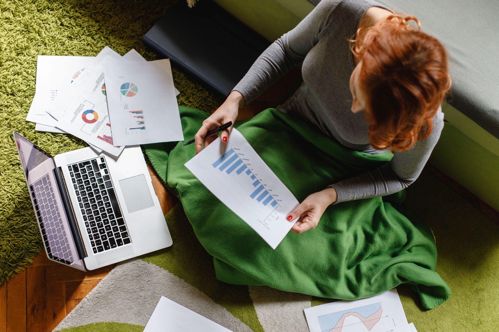Business owner reviewing financial documents for bookkeeping