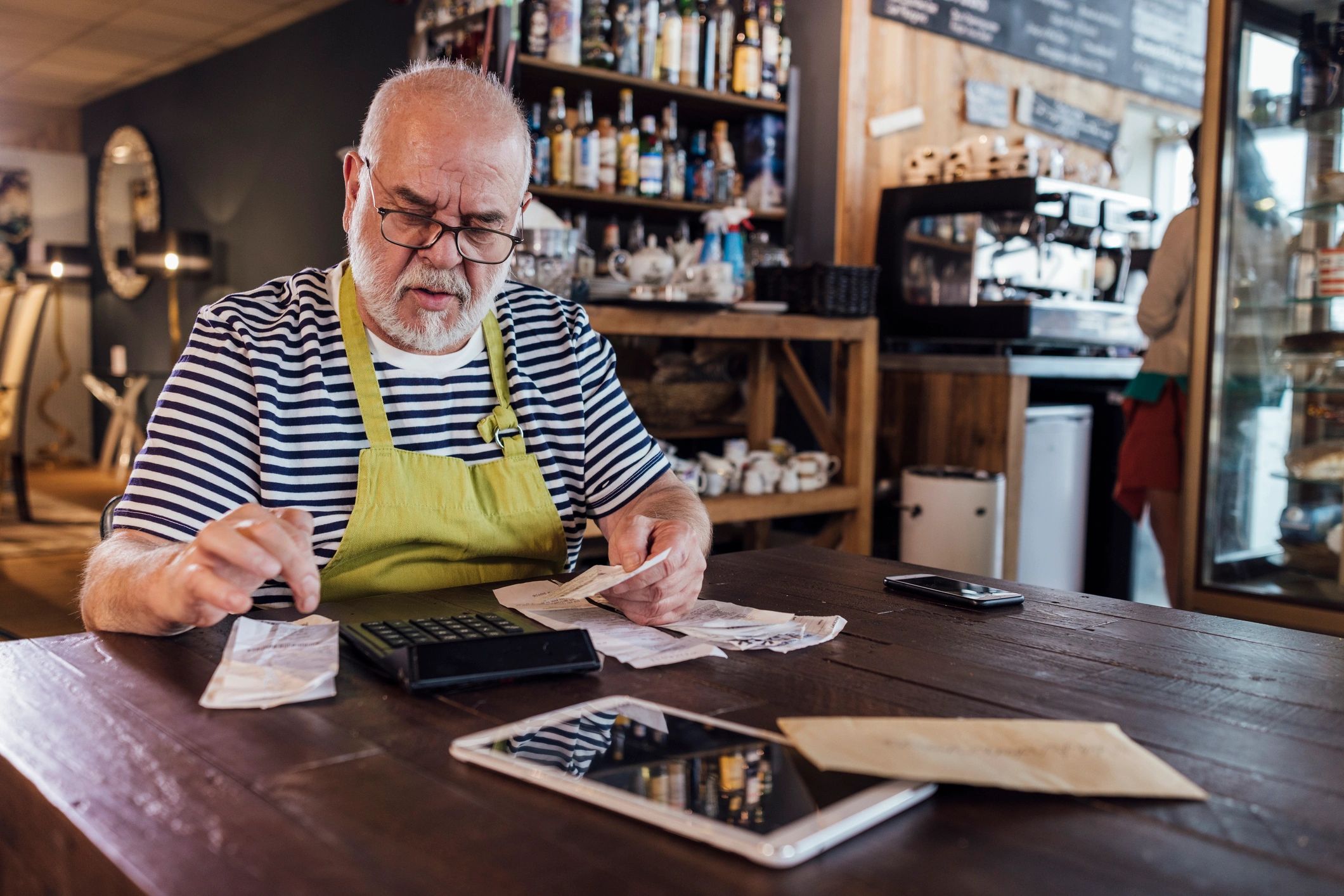 Business owner calculating finances at a desk