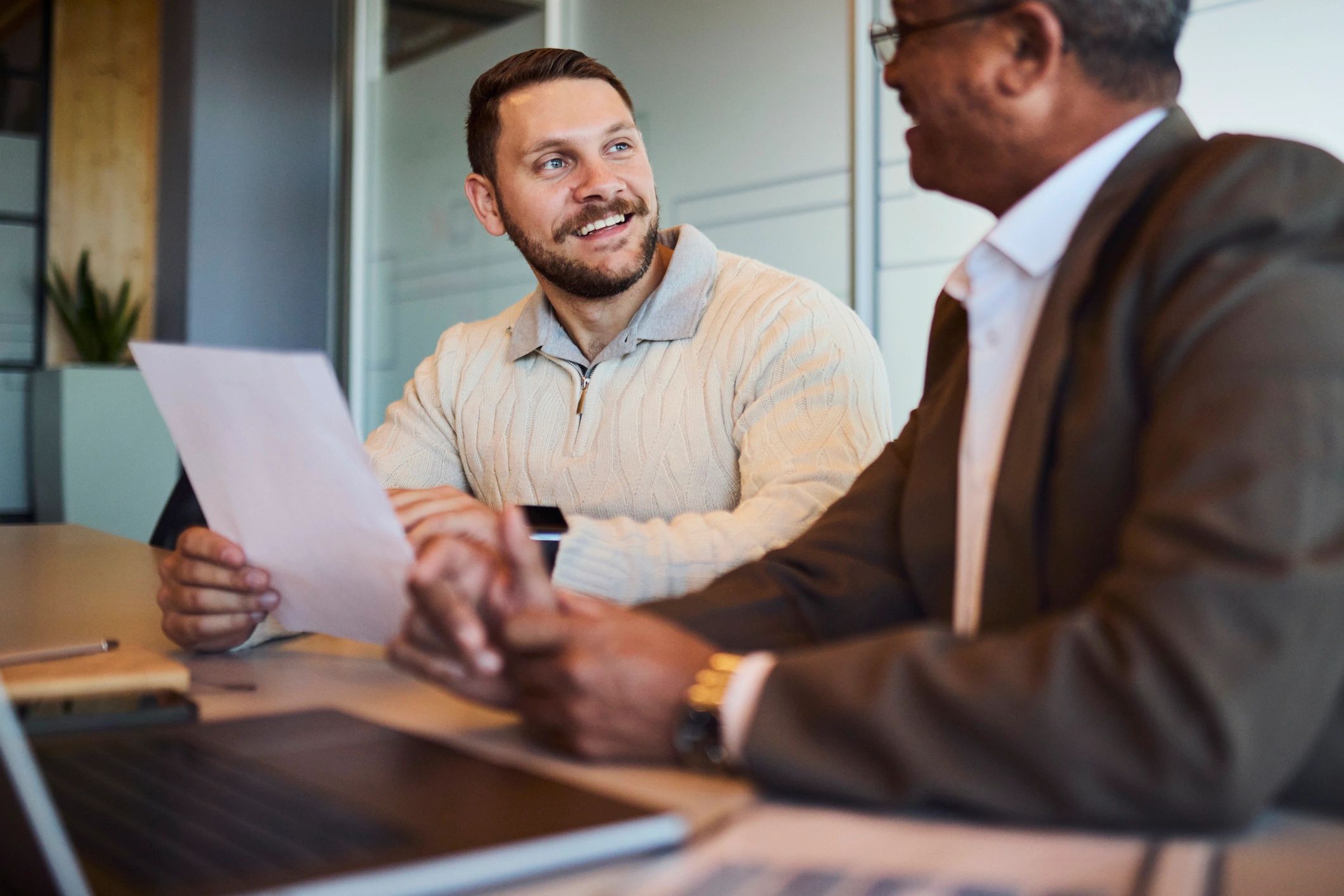 Advisor and client reviewing tax paperwork together